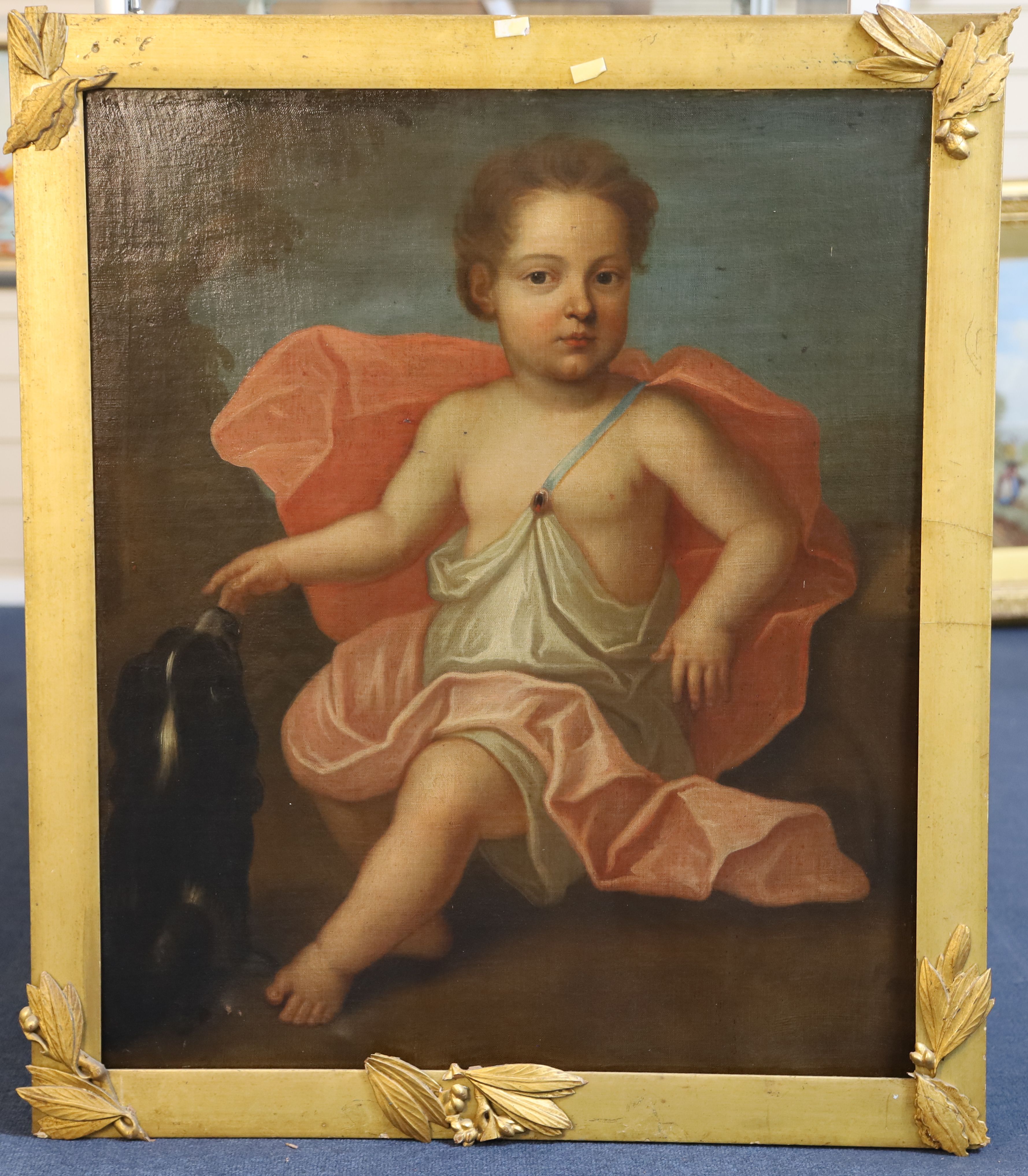 Late 18th Century English School Full length portrait of a child wearing classical robes seated beside a spaniel 29 x 24.5in.